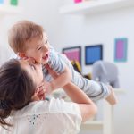 picture of happy mother playing with baby boy